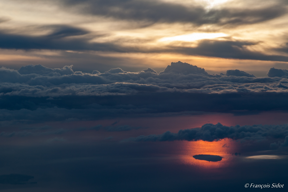 Sunset above the skyline of the island